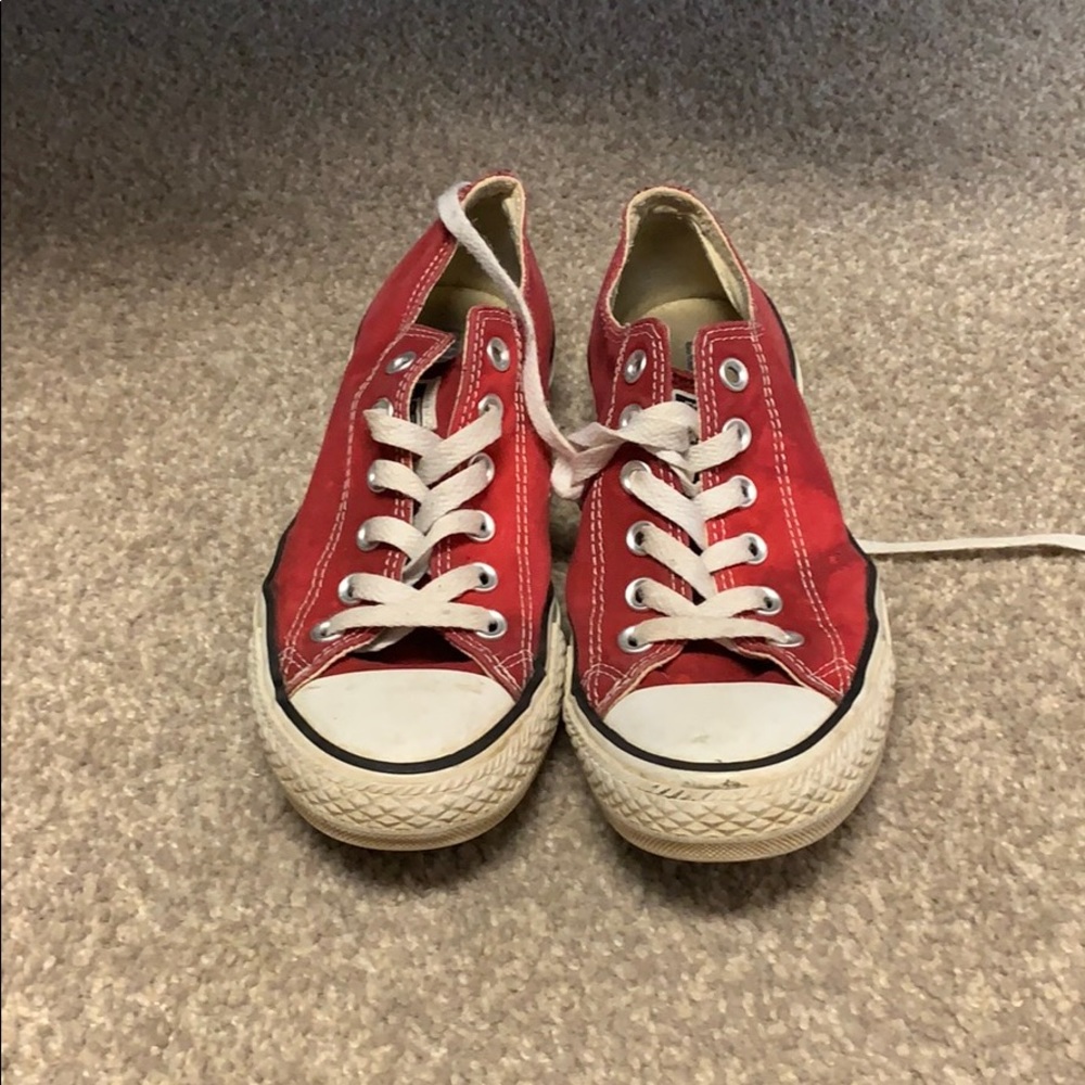 Worn red low top converse
